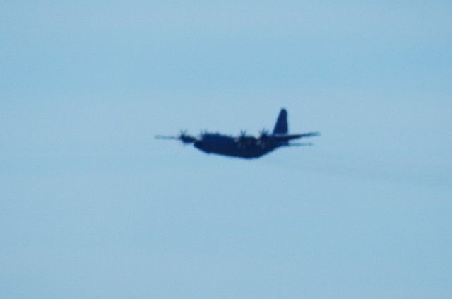 A C-130 Hercules aircraft flies over South Post on March 13, 2025, at Fort McCoy, Wis., as part of training operations. The C-130 Hercules primarily performs the tactical portion of the U.S. Air Force&#39;s airlift mission, and Air National Guard...