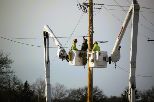 Contractors work on power lines Feb. 10, 2025, on the cantonment area at Fort McCoy, Wis. The work is part of an ongoing electrical grid upgrade at the installation where the post will go from a from a Delta Electrical System to a Wye Electrical...