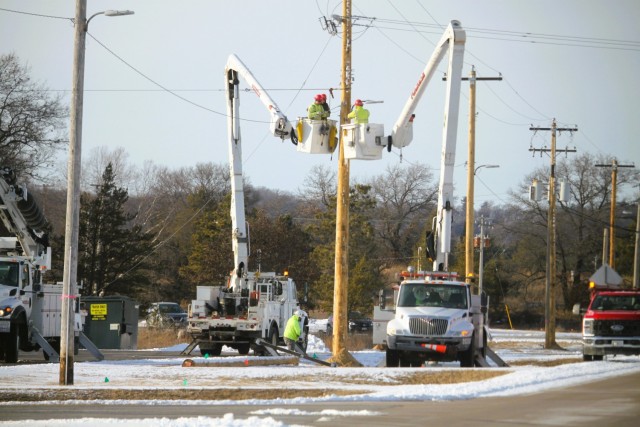Contractors work on power lines Feb. 10, 2025, on the cantonment area at Fort McCoy, Wis. The work is part of an ongoing electrical grid upgrade at the installation where the post will go from a from a Delta Electrical System to a Wye Electrical...