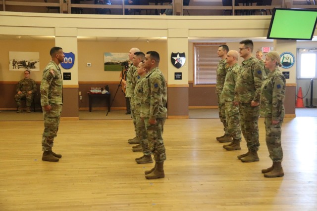 A scene from a patching ceremony held March 13, 2025, is shown in building 905 at Fort McCoy, Wis. Soldiers with U.S. Army Garrison-Fort McCoy traded out the Army Materiel Command patches on their uniforms for the blue clover patch of the 88th...