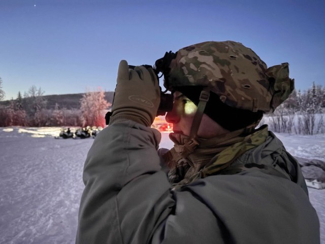 A Soldier from the 2nd Brigade Combat Team, 10th Mountain Division adjusts his night-vision goggles during the Cold Weather Indoctrination Course on 8 February 2025 at Fort Wainwright, AK, ahead of Arctic Forge 25.