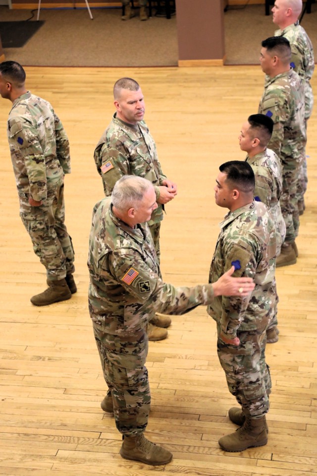 A scene from a patching ceremony held March 13, 2025, is shown in building 905 at Fort McCoy, Wis. Soldiers with U.S. Army Garrison-Fort McCoy traded out the Army Materiel Command patches on their uniforms for the blue clover patch of the 88th...