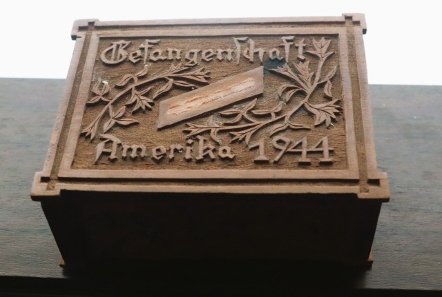 A small, wooden keepsake box adorned with carvings and the inscription, “Gefangenschaft Amerika 1944,” is shown Feb. 12, 2025, at Fort McCoy, Wis. The box was donated in late January 2025 to the Fort McCoy Public Affairs Office for inclusion...