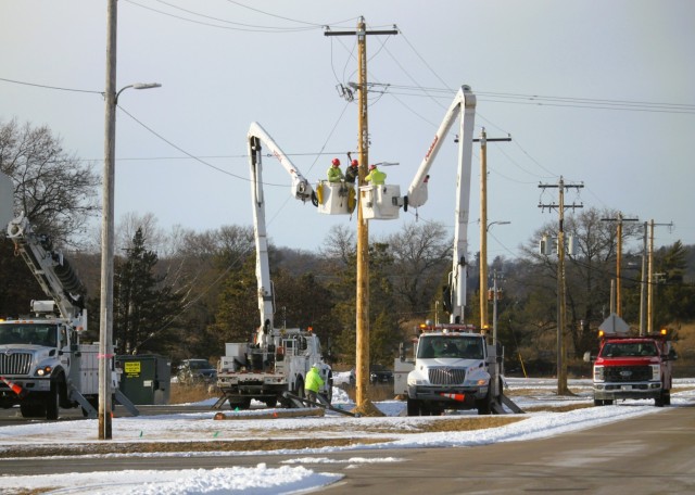 Contractors work on power lines Feb. 10, 2025, on the cantonment area at Fort McCoy, Wis. The work is part of an ongoing electrical grid upgrade at the installation where the post will go from a from a Delta Electrical System to a Wye Electrical...