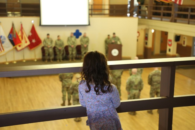 A scene from a patching ceremony held March 13, 2025, is shown in building 905 at Fort McCoy, Wis. Soldiers with U.S. Army Garrison-Fort McCoy traded out the Army Materiel Command patches on their uniforms for the blue clover patch of the 88th...