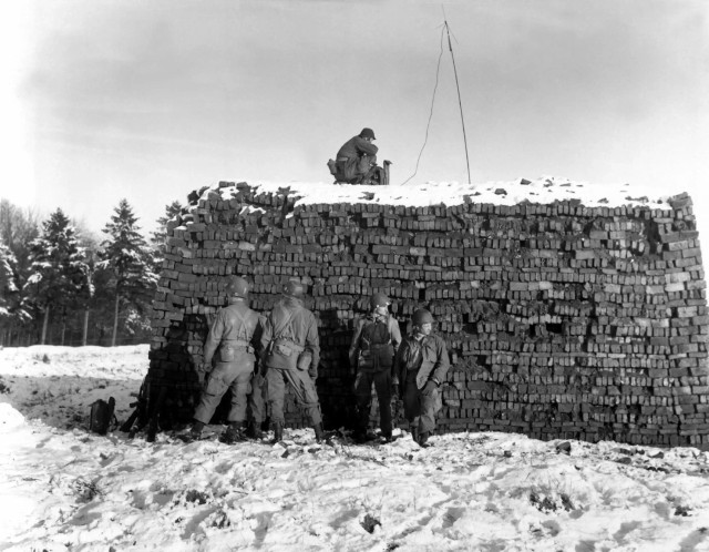 After parachuting in, the 101st Airborne Division’s pathfinder unit sets up radar equipment near Bastogne, Belgium, on 23 December 1944.
