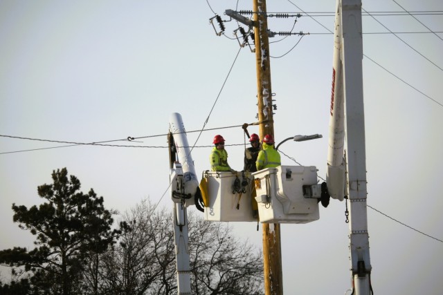 Contractors work on power lines Feb. 10, 2025, on the cantonment area at Fort McCoy, Wis. The work is part of an ongoing electrical grid upgrade at the installation where the post will go from a from a Delta Electrical System to a Wye Electrical...