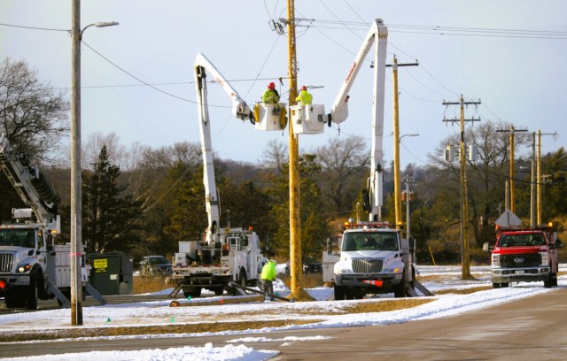 Contractors work on power lines Feb. 10, 2025, on the cantonment area at Fort McCoy, Wis. The work is part of an ongoing electrical grid upgrade at the installation where the post will go from a from a Delta Electrical System to a Wye Electrical...