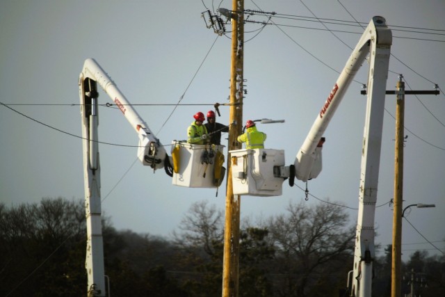 Contractors work on power lines Feb. 10, 2025, on the cantonment area at Fort McCoy, Wis. The work is part of an ongoing electrical grid upgrade at the installation where the post will go from a from a Delta Electrical System to a Wye Electrical...