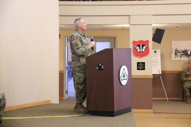 A scene from a patching ceremony held March 13, 2025, is shown in building 905 at Fort McCoy, Wis. Soldiers with U.S. Army Garrison-Fort McCoy traded out the Army Materiel Command patches on their uniforms for the blue clover patch of the 88th...