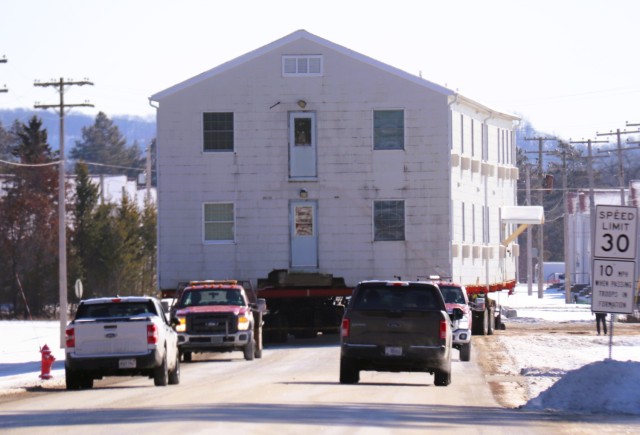A barracks building from the 1600 block at Fort McCoy, Wis., is shown being moved Feb. 13, 2025, from the 1600 block to another area of the installation. Contractors are moving several buildings in January and February 2025. These buildings will...