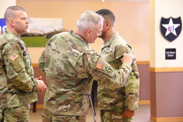 A scene from a patching ceremony held March 13, 2025, is shown in building 905 at Fort McCoy, Wis. Soldiers with U.S. Army Garrison-Fort McCoy traded out the Army Materiel Command patches on their uniforms for the blue clover patch of the 88th...
