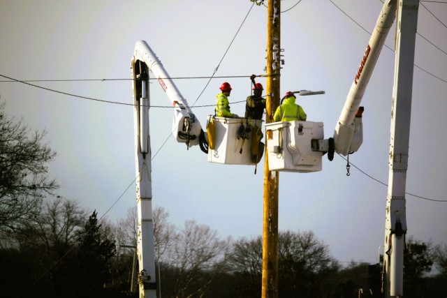 Contractors work on power lines Feb. 10, 2025, on the cantonment area at Fort McCoy, Wis. The work is part of an ongoing electrical grid upgrade at the installation where the post will go from a from a Delta Electrical System to a Wye Electrical...