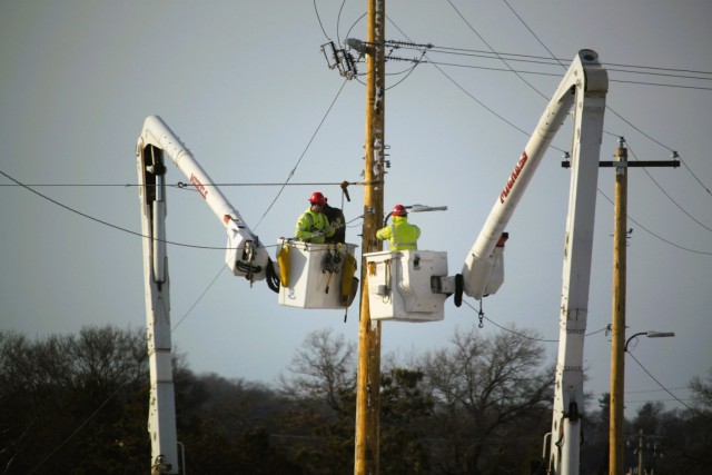 Contractors work on power lines Feb. 10, 2025, on the cantonment area at Fort McCoy, Wis. The work is part of an ongoing electrical grid upgrade at the installation where the post will go from a from a Delta Electrical System to a Wye Electrical...