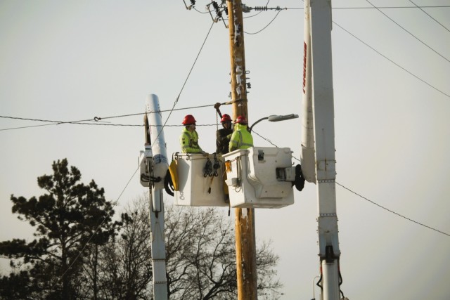Contractors work on power lines Feb. 10, 2025, on the cantonment area at Fort McCoy, Wis. The work is part of an ongoing electrical grid upgrade at the installation where the post will go from a from a Delta Electrical System to a Wye Electrical...