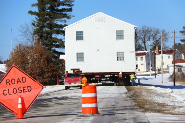 A barracks building from the 1600 block at Fort McCoy, Wis., is shown being moved Feb. 13, 2025, from the 1600 block to another area of the installation. Contractors are moving several buildings in January and February 2025. These buildings will...