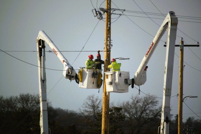 Contractors work on power lines Feb. 10, 2025, on the cantonment area at Fort McCoy, Wis. The work is part of an ongoing electrical grid upgrade at the installation where the post will go from a from a Delta Electrical System to a Wye Electrical...