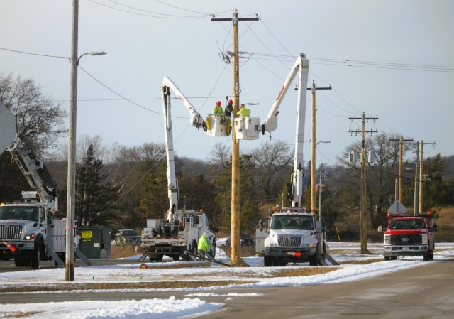Contractors work on power lines Feb. 10, 2025, on the cantonment area at Fort McCoy, Wis. The work is part of an ongoing electrical grid upgrade at the installation where the post will go from a from a Delta Electrical System to a Wye Electrical...