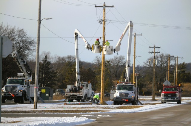 Contractors work on power lines Feb. 10, 2025, on the cantonment area at Fort McCoy, Wis. The work is part of an ongoing electrical grid upgrade at the installation where the post will go from a from a Delta Electrical System to a Wye Electrical...