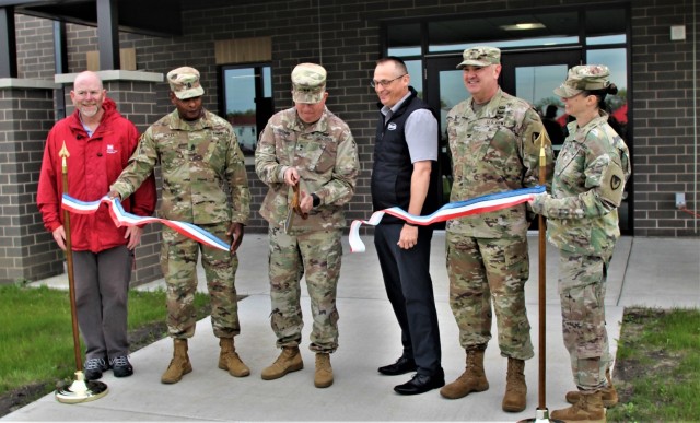 Officials cut the ribbon May 18, 2022, during a special ribbon-cutting ceremony to open the new fiscal year 2019-funded barracks at Fort McCoy, Wis. Fort McCoy’s senior leadership, state and federal representatives and staffers, and dozens of...