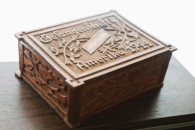 A small, wooden keepsake box adorned with carvings and the inscription, “Gefangenschaft Amerika 1944,” is shown Feb. 12, 2025, at Fort McCoy, Wis. The box was donated in late January 2025 to the Fort McCoy Public Affairs Office for inclusion...