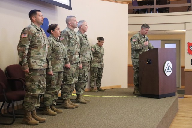 A scene from a patching ceremony held March 13, 2025, is shown in building 905 at Fort McCoy, Wis. Soldiers with U.S. Army Garrison-Fort McCoy traded out the Army Materiel Command patches on their uniforms for the blue clover patch of the 88th...