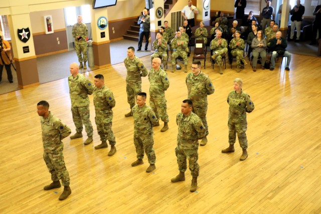 A scene from a patching ceremony held March 13, 2025, is shown in building 905 at Fort McCoy, Wis. Soldiers with U.S. Army Garrison-Fort McCoy traded out the Army Materiel Command patches on their uniforms for the blue clover patch of the 88th...