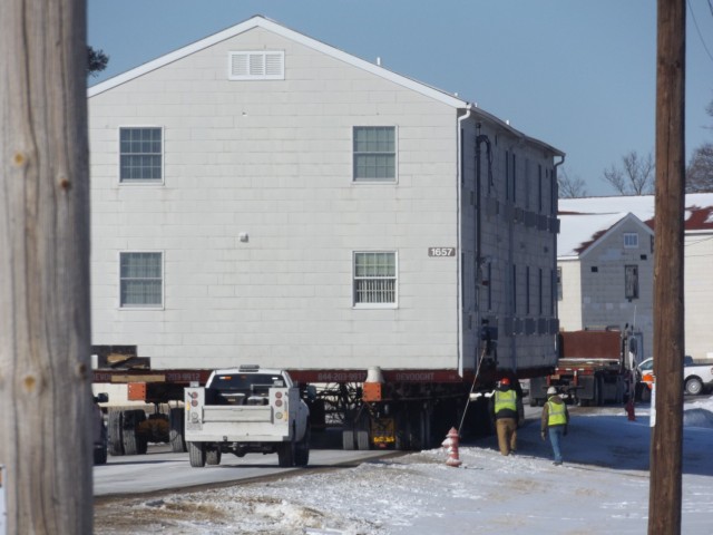 A barracks building from the 1600 block at Fort McCoy, Wis., is shown being moved Feb. 13, 2025, from the 1600 block to another area of the installation. Contractors are moving several buildings in January and February 2025. These buildings will...