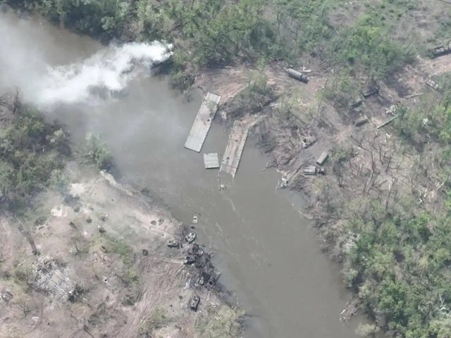 Figure 2 — Photo of the Crossing Site and Destroyed Pontoon Bridges and Vehicles