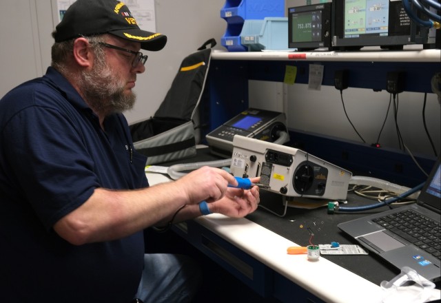 Technician working in TMDE lab