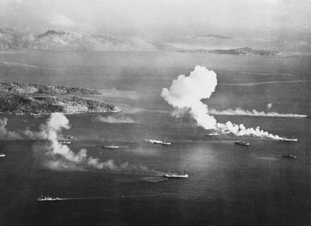 Japanese ships burn after an air attack in Truk Lagoon, as seen from a USS Intrepid (CV-11) aircraft on 17 February 1944, the first day of raids.