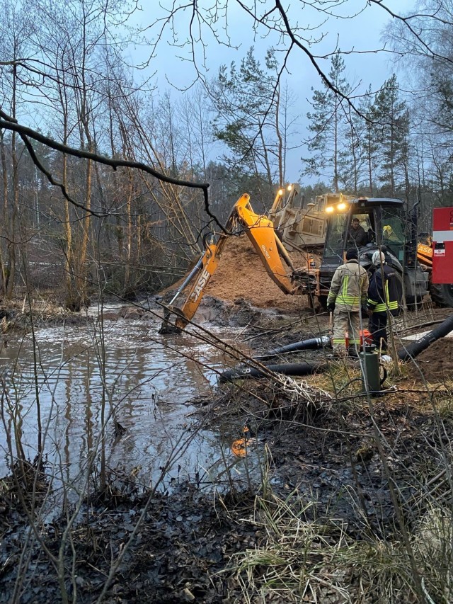 Lithuanian engineers and emergency workers attempt to clear mud and water to recover a U.S. Army M88 Hecules armored vehicle March 27 near Pabradė, Lithuania. Lithuanians from across the country’s national and local government have aided U.S....