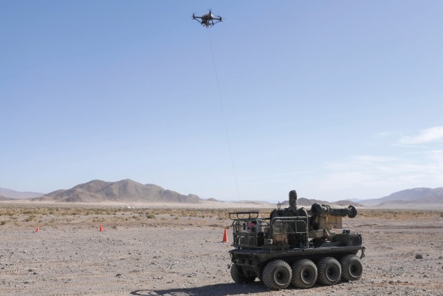 A U.S. Army Origin autonomous weapons system uses a tethered UAS to help Soldiers perform reconnaissance of an area during Project Convergence 22 experimentation Oct. 26, 2022, on Fort Irwin, California. (U.S. Army photo by Spc. Jaaron Tolley)