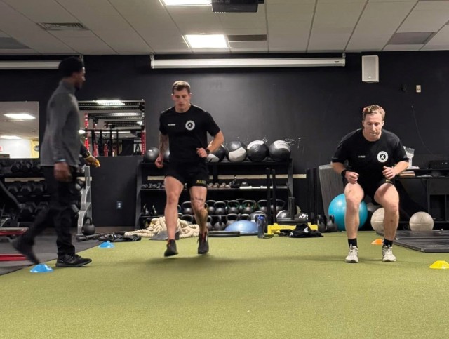 A 198th Infantry Brigade strength coach runs cadre members through dynamic warm-up drills during the TSAC-F. (Photo courtesy of author)