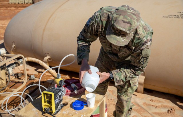 Crafting Safe Water: U.S. Army Warrant Officer Prepares Chlorine Solution at Al-Tanf Garrison, Syria