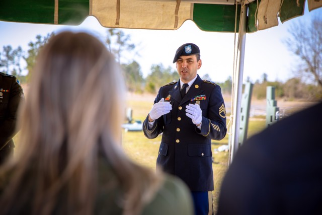 Staff Sgt. Joseph Nixon, assigned to the Installation Support Detachment, explains the significance of the Army’s funeral honors ceremony to local leadership program participants during Fort Eisenhower’s Military Day.