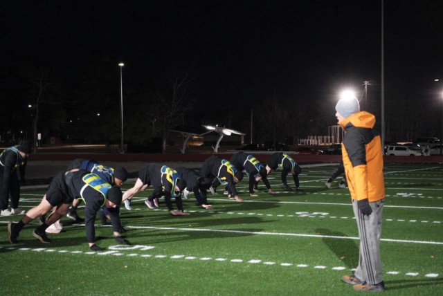A 198th Infantry Brigade strength coach instructs cadre members on conducting proper warm-up drills. (Photos courtesy of author)