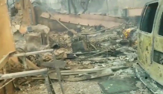 Rafael Calvo returned home to find what remained of his property after the wildfire. The house was still hot as he assessed the damage.