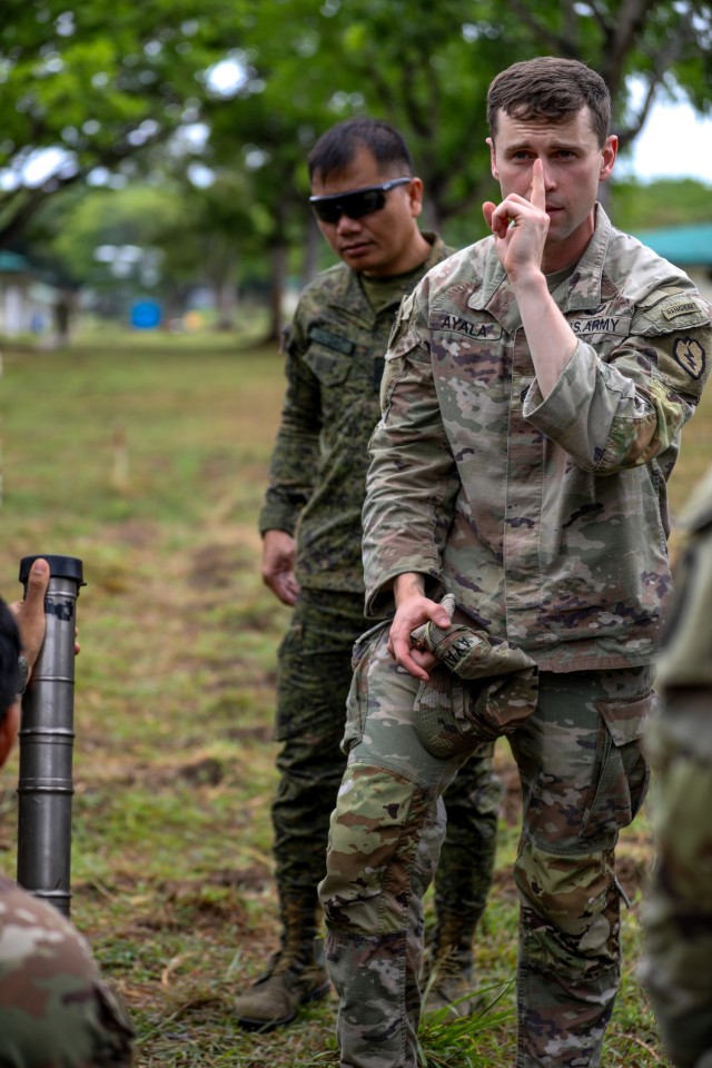 U.S. Army Staff Sgt. Robert Ayala, acting mortar platoon sergeant of the Cross-Domain Effects Company, 1st Battalion, 21st Infantry Regiment (Task Force Gimlet), 25th Infantry Division, instructs soldiers of the Philippine Army 5th and 7th...