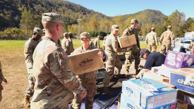 Soldiers assigned to the 2nd Battalion, 502nd Infantry Regiment unload a trailer of supplies at a local community relief center in Brunsville, NC, on 10 October 2024. (Photo by MSG Anthony Hewitt)