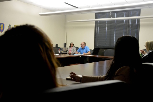 Army Community Services Specialist Doug Schwab (center) conducts a training session with the Fort Novosel Emergency Family Assistance Center personnel. The EFAC can help connect Soldiers, family members, and civilian employees with vital resources...