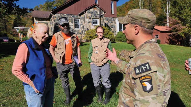 A Soldier from the 2nd Mobile Brigade Combat Team, 101st Airborne Division meets with civilians during hurricane relief operations. (Photo courtesy of the 101st Airborne Division Public Affairs Office)