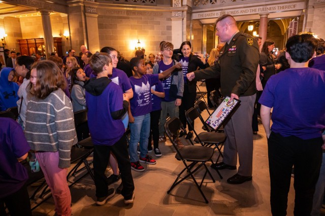 Maj. Gen. Christopher Beck, Maneuver Support Center of Excellence and Fort Leonard Wood commanding general, greets Waynesville School District students April 1 during the State of Missouri Month of the Military Child kickoff in the Missouri State...