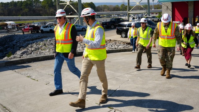 Joe Cotton, project manager with the U.S. Army Corps of Engineers Nashville District, walks with Rep. Mike Collins, Georgia 10th District, chairman of the House Subcommittee on Water Resources and Environment, while describing the Chickamauga Lock...