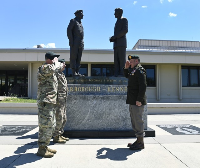 A Special Forces warrant officer graduate conducts his first salute following his official appointment as a warrant officer after graduating from the Special Forces Warrant Officer Institute under the U.S. Army John F. Kennedy Special Warfare...