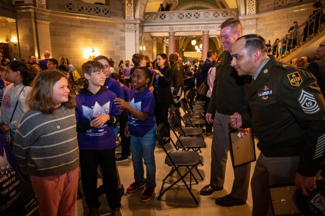 Maj. Gen. Christopher Beck, Maneuver Support Center of Excellence and Fort Leonard Wood commanding general, and MSCoE and Fort Leonard Wood Command Sgt. Maj. Jorge Arzabala, spend time chatting with Waynesville School District students April 1...