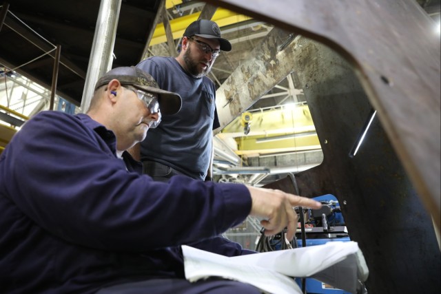 LEAD artisans work together to complete Navy project