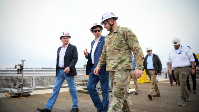 Lt. Col. Robert Green (right), commander of the Nashville District U.S. Army Corps of Engineers, walks with Rep. Dale Strong (middle) of Alabama's 5th Congressional District and Rep. Mike Collins (left) of Georgia's 10th Congressional District...