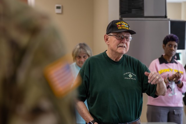 Tom Finch speaks about his experience returning home from Vietnam during the Vietnam War Veterans Day celebration Friday at the Exchange food court.