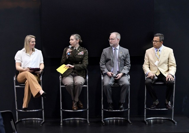 Garrison Commander Col. Erin Eike speaks during the Institutional Training and Transformation session at the Warriors Corner during the Global Force Symposium and Exposition, March 26 at the Von Braun Center. From left are Erin Bearhalter, project...